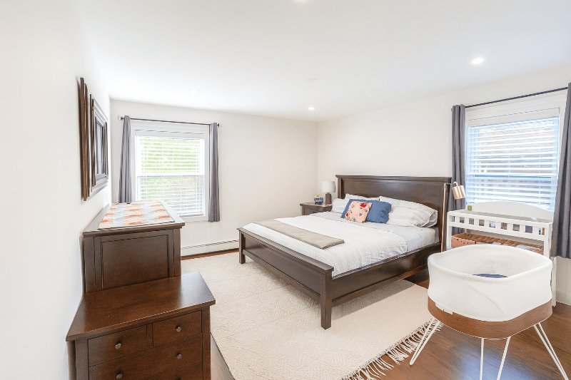 After - bedroom with window highlights recovered and interior balanced